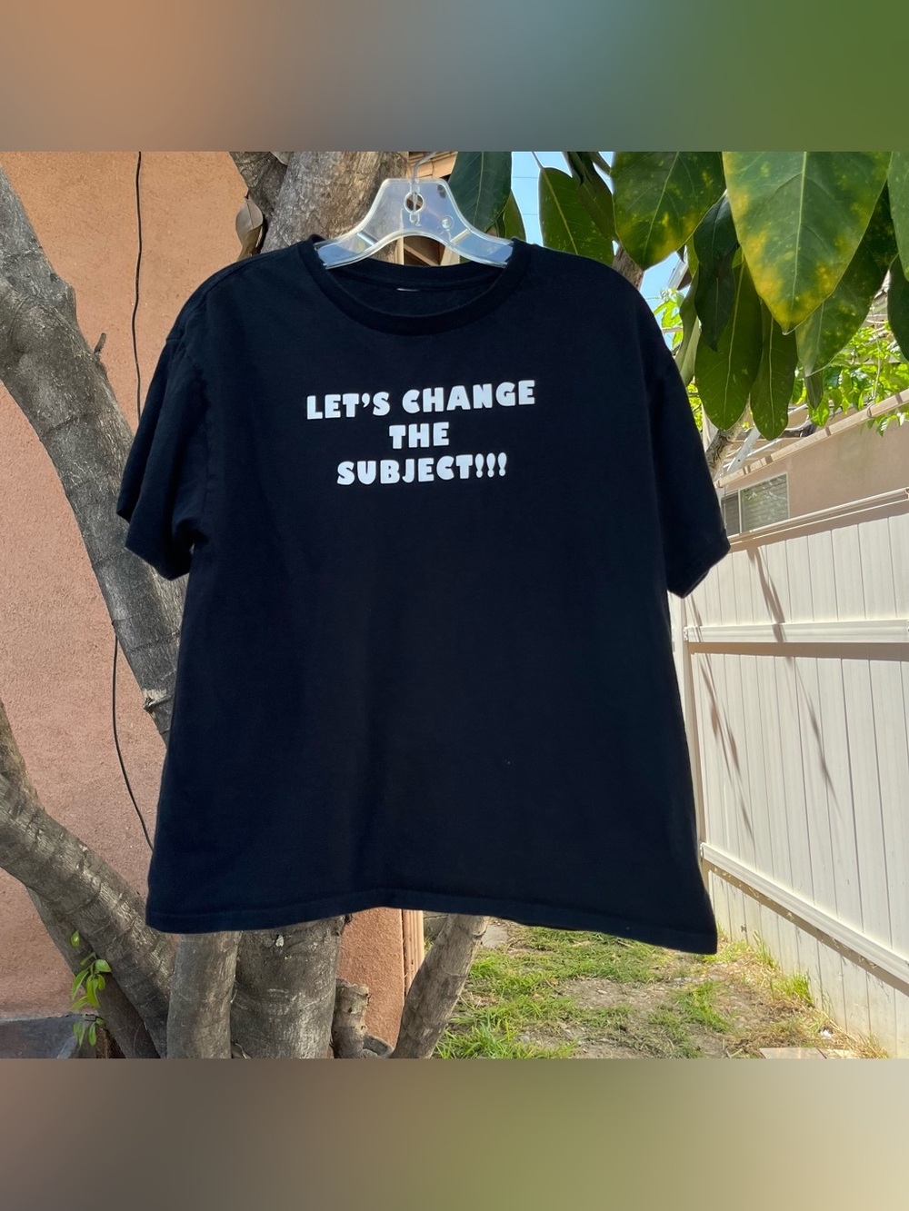 “Let’s Change the Subject!!!” Black Graphic T-Shirt .